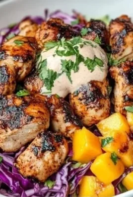 Delicious Jerk Chicken and Mango Slaw Bowls with Honey Lime Cream