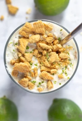 Delicious Key Lime Pie Overnight Oats topped with lime zest and coconut flakes.