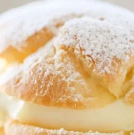 Delicious homemade lemon cream puffs with a creamy lemon filling.