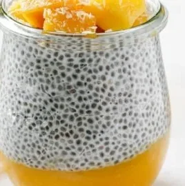 Delicious mango coconut chia pudding topped with fresh mango slices