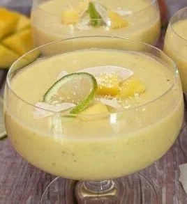 Delicious Mango Coconut Dessert Cups topped with fresh mango and coconut flakes