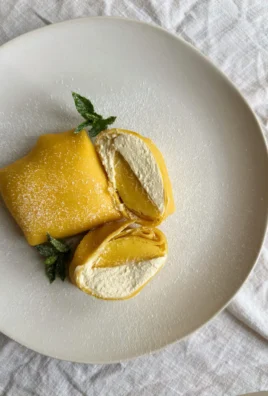 Delicious mango pancakes topped with fresh mango slices and syrup
