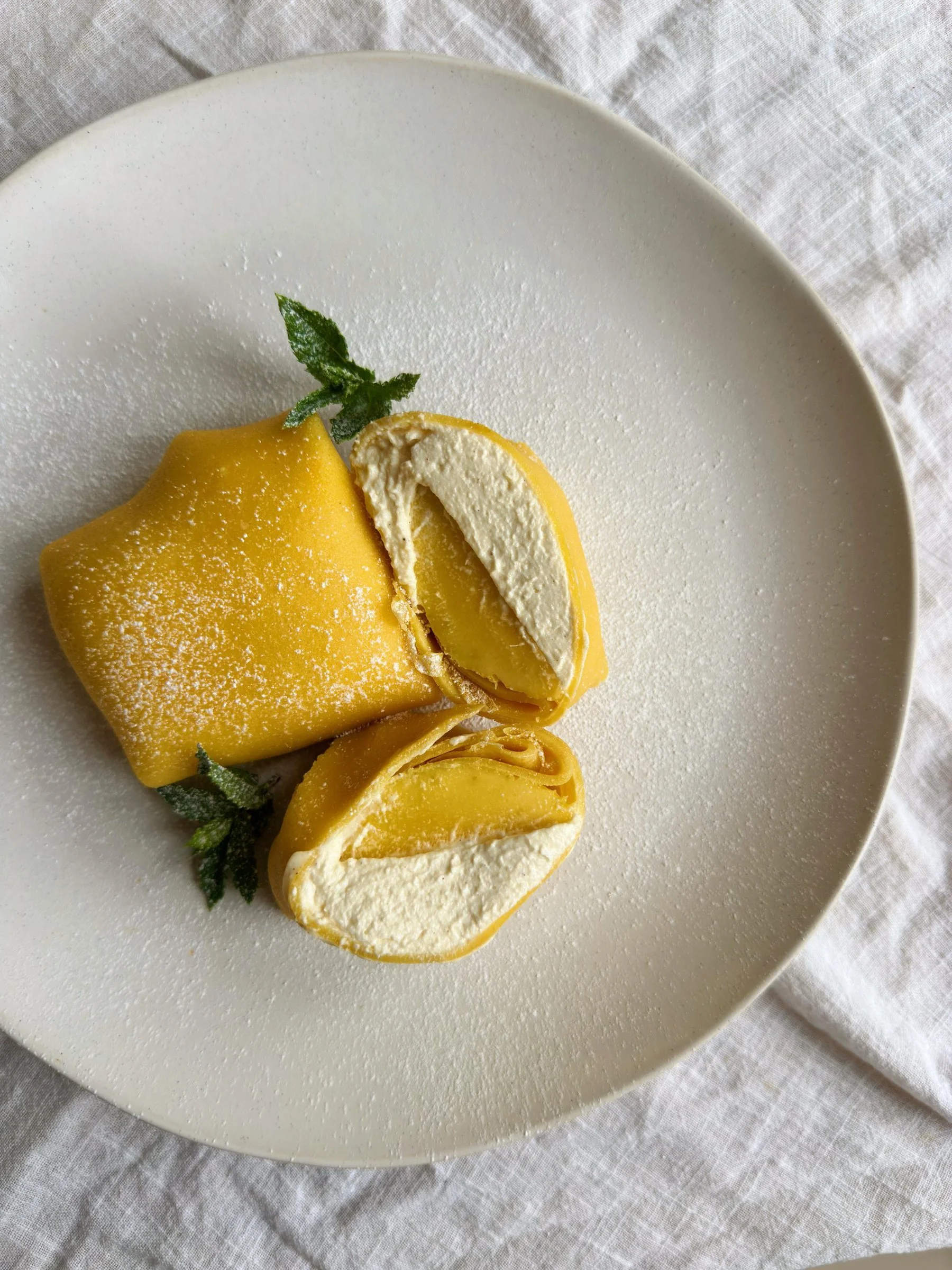 Delicious mango pancakes topped with fresh mango slices and syrup