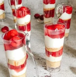 Delicious mini cherry cheesecake cups on a platter