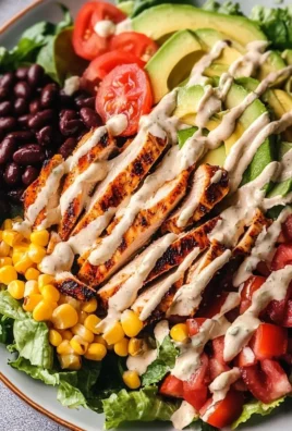 A colorful Spicy Southwest Salad with fresh vegetables and a vibrant dressing.