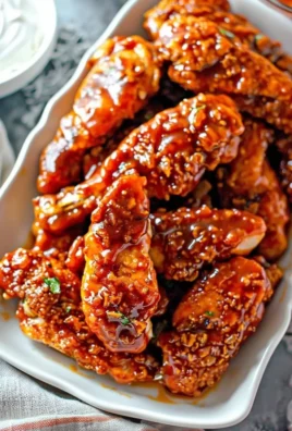 Plate of Sweet and Spicy Chicken garnished with herbs
