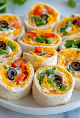 Taco Cream Cheese Pinwheels served on a platter