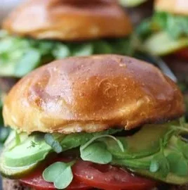 A spread of colorful vegan BBQ dishes on a grill, showcasing gluten-free recipes.