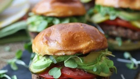 A spread of colorful vegan BBQ dishes on a grill, showcasing gluten-free recipes.