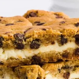 Delicious chocolate chip cheesecake bars topped with chocolate chips