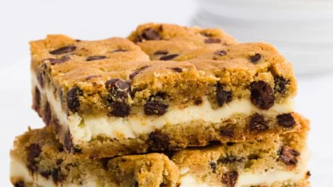 Delicious chocolate chip cheesecake bars topped with chocolate chips