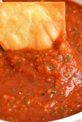 Bowl of easy homemade salsa made with fresh tomatoes and herbs