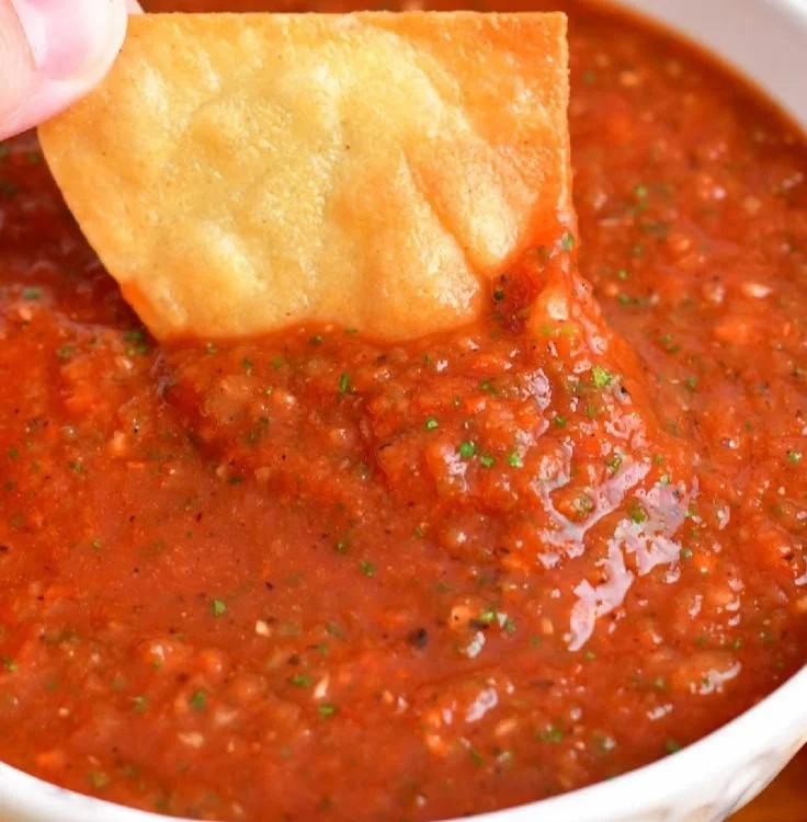 Bowl of easy homemade salsa made with fresh tomatoes and herbs