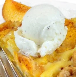 Freshly baked peach custard pie with juicy peach slices on top