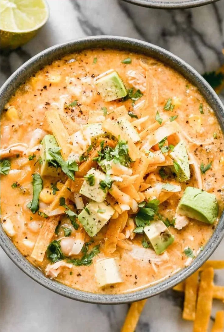 Bowl of healthy high protein white chicken chili topped with fresh cilantro.