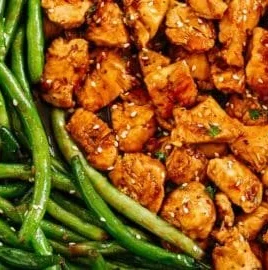 Plate of honey garlic chicken served with green beans