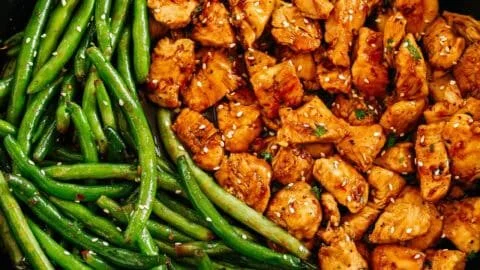 Plate of honey garlic chicken served with green beans