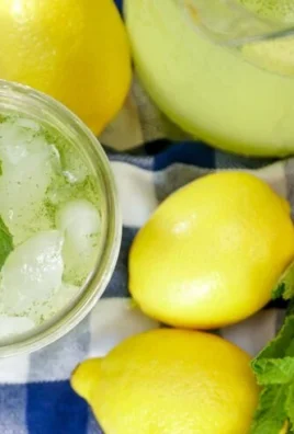 Glass of Moroccan mint lemonade garnished with fresh mint leaves.