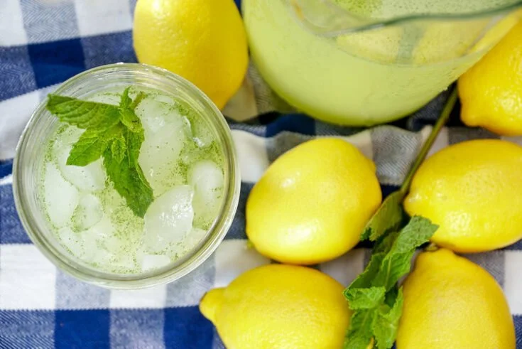 Glass of Moroccan mint lemonade garnished with fresh mint leaves.