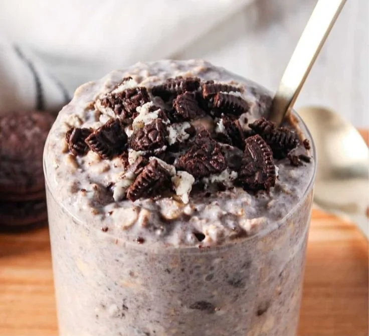 Bowl of delicious Oreo Overnight Oats topped with crushed Oreos and chocolate.