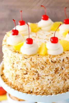 Pina Colada Layer Cake with pineapple and coconut decorations