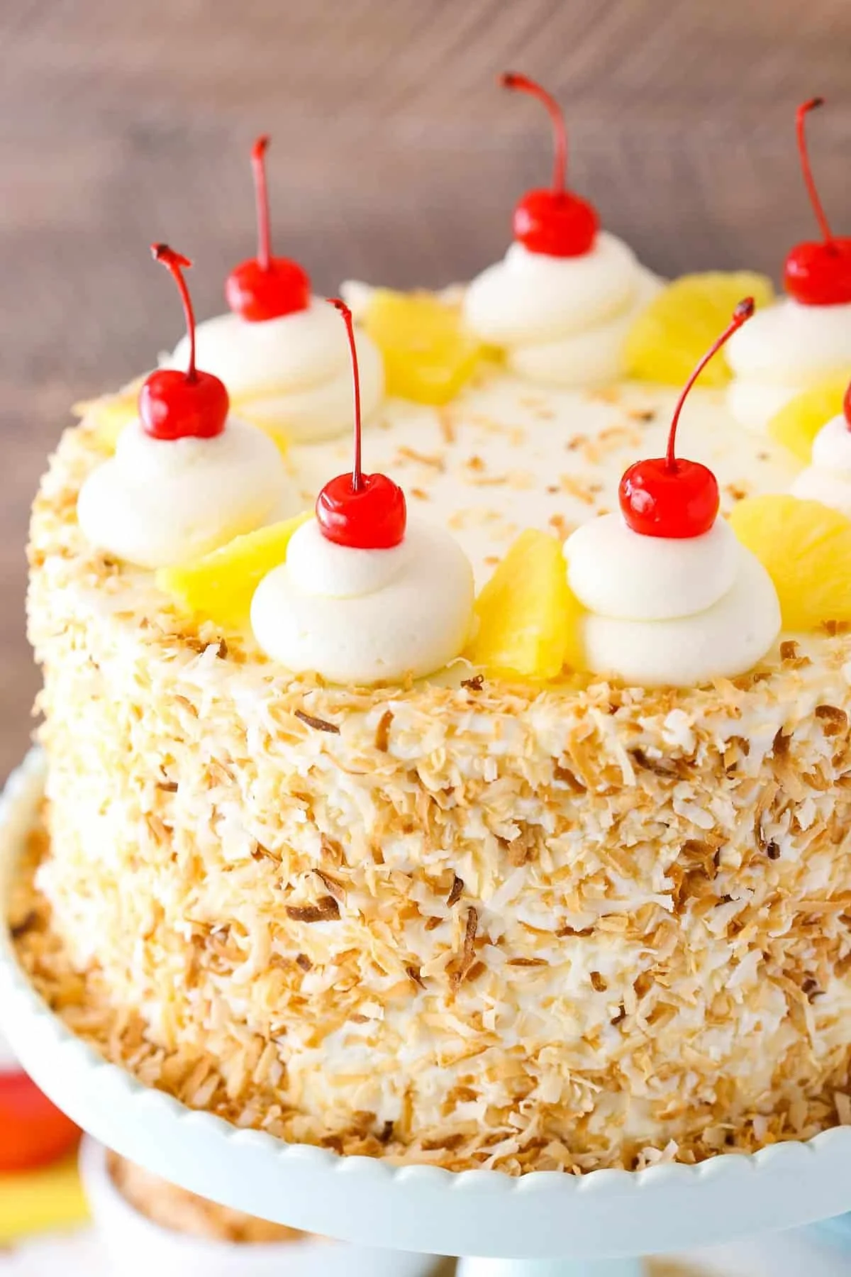 Pina Colada Layer Cake with pineapple and coconut decorations