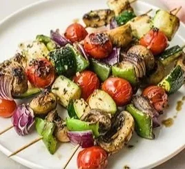 Colorful roasted veggie kebabs on a grill, showcasing healthy vegetable choices.