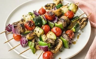 Colorful roasted veggie kebabs on a grill, showcasing healthy vegetable choices.