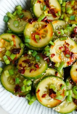 Fresh and vibrant TikTok cucumber salad prepared with sliced cucumbers and herbs