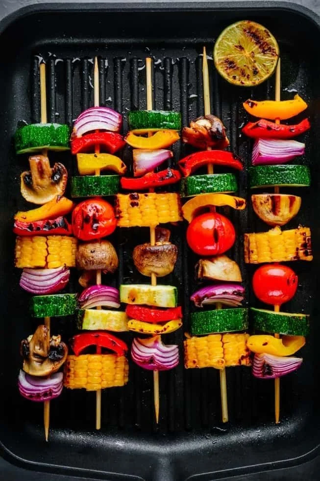 Colorful veggie kabobs on skewers ready for grilling