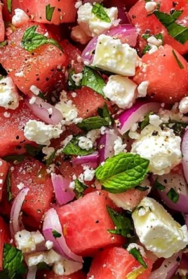 Fresh watermelon feta salad with mint on a white plate