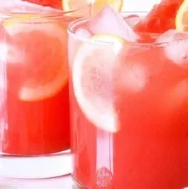 Refreshing watermelon lemonade in a glass with mint garnish